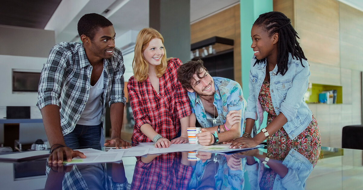 People working together at conference table in office
