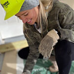 Female worker helping with a construction project.