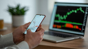 person viewing stock market volatility on phone