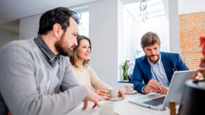 A husband and wife in their late 50s meet with their financial professional to discuss if a Roth IRA makes sense for their financial goals.