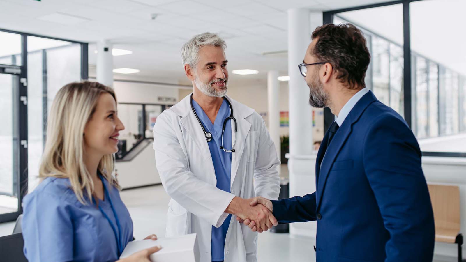 Physician and nurse meeting a prospective healthcare worker.